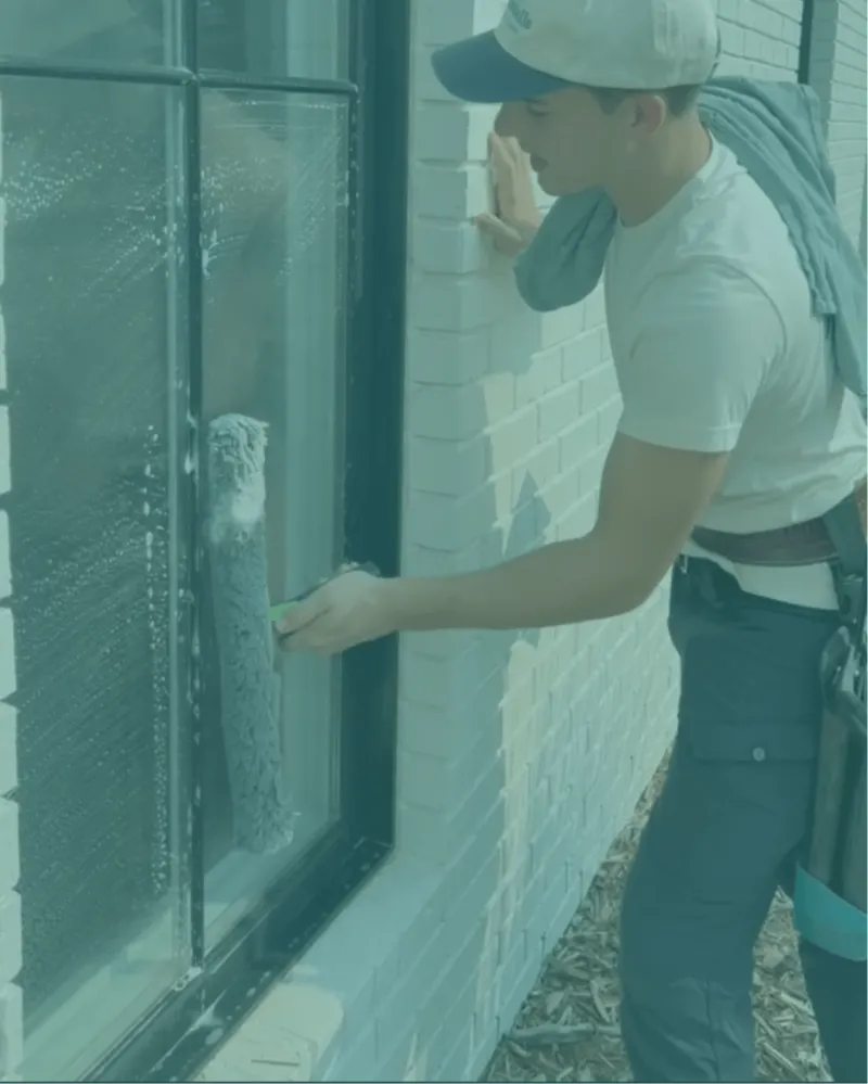 Fontenelle technician wetting a window with cleaning solution