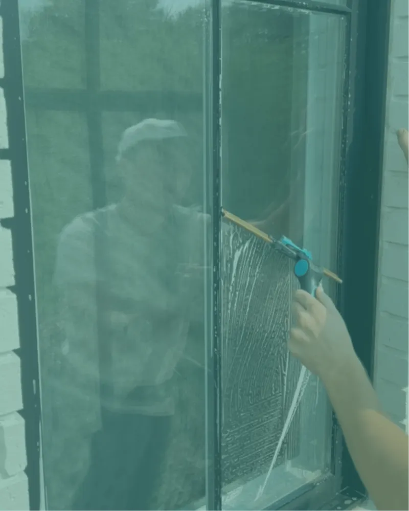 Squeegeeing a window streak-free