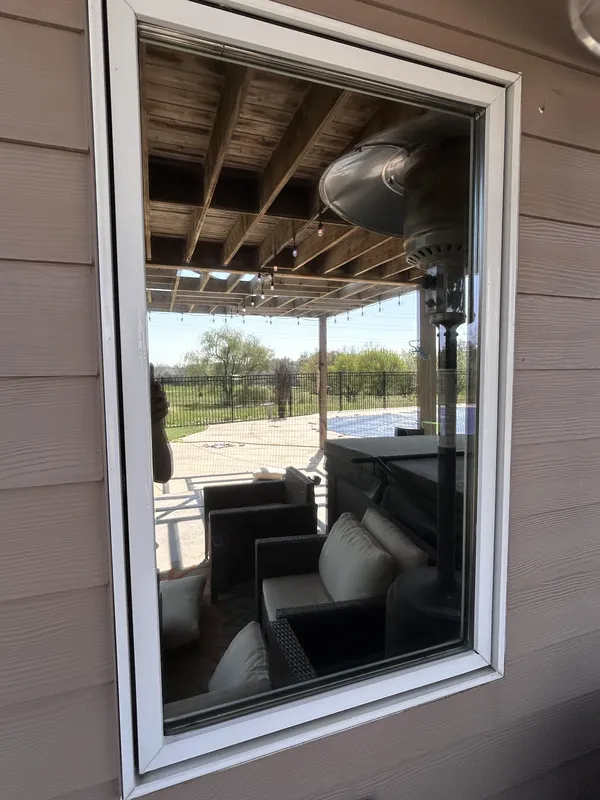 After: Exterior window on a tan house